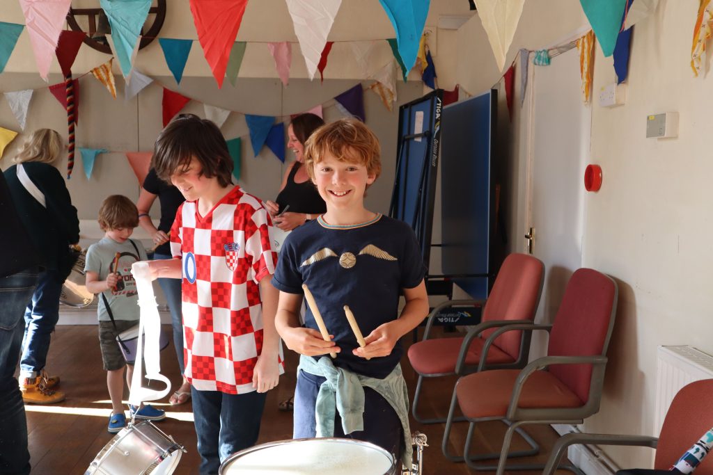 Cheerful children hold instruments
