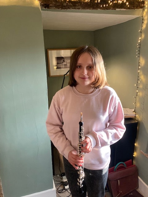 Young women holding oboe