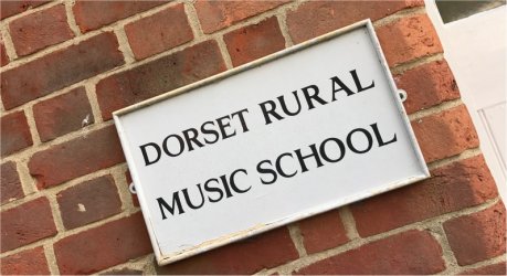 Sign reading 'Dorset Rural Music School'