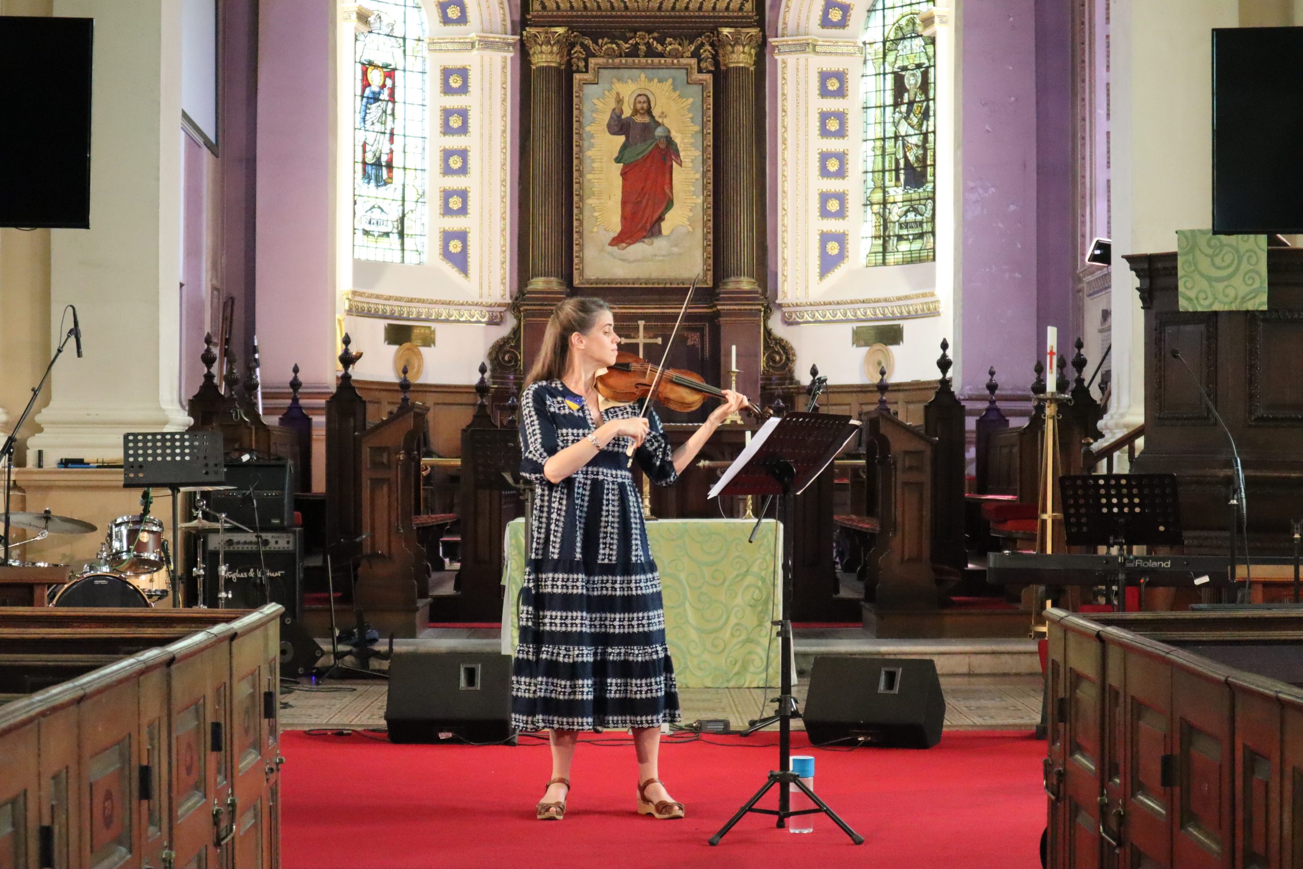 Woman plays violin in church